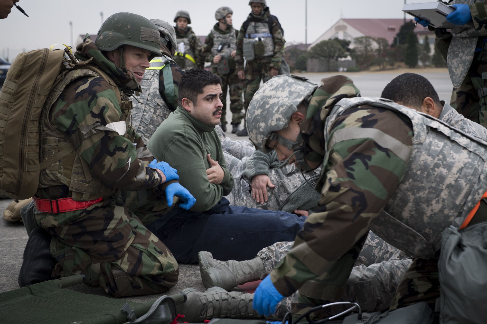 Simulated victims of a missile attack are prepared for transportation by members of the 374th Medical Squadron during exercise Beverly Morning 17-08 in conjunction with exercise Vigilant Ace 18, Dec. 4, 2017, at Yokota Air Base, Japan.