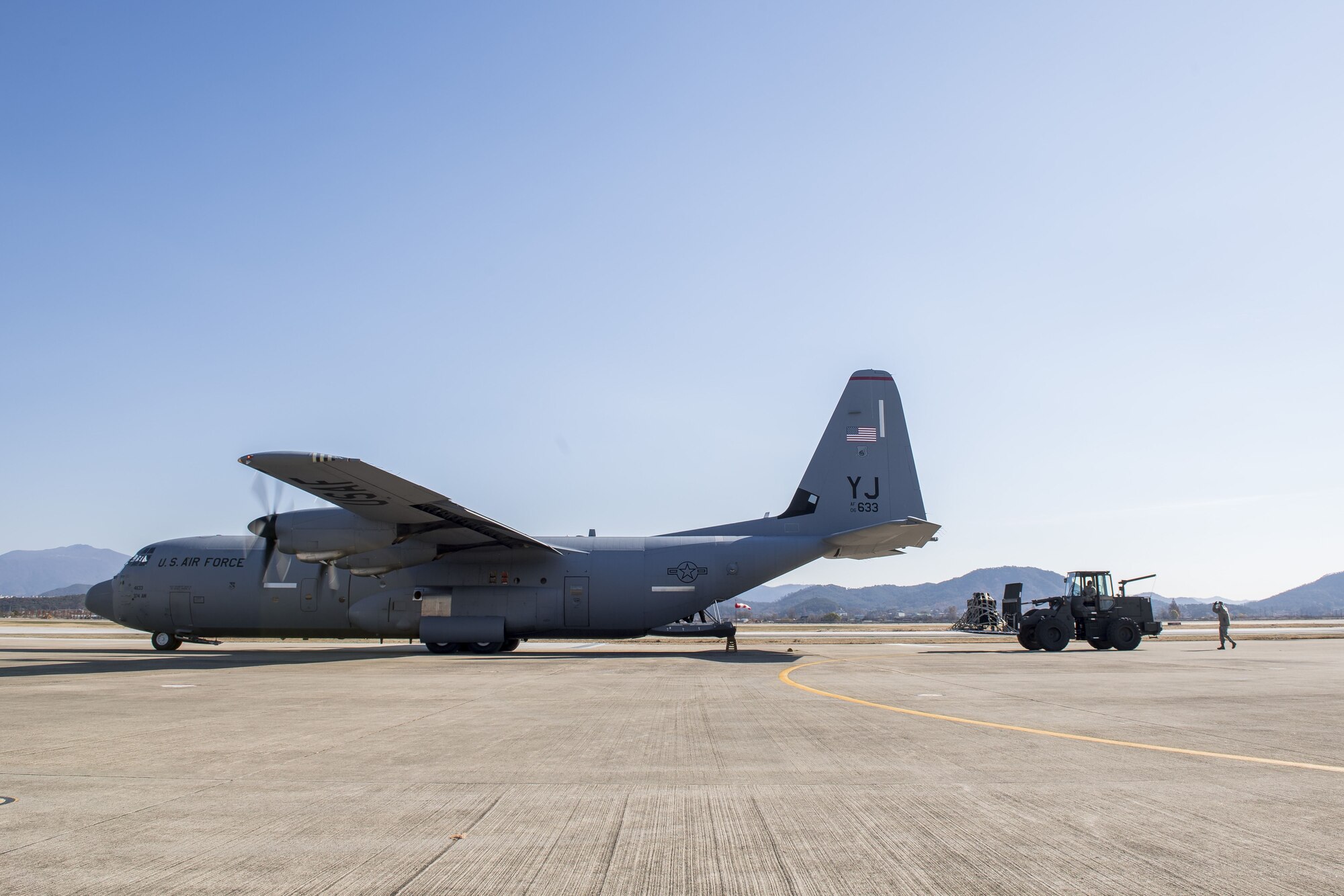 Airmen unload cargo from a C-130J Super Hercules from Yokota Air Base in preparation for exercise Vigilant Ace 18, Dec. 1, 2017, at Gwangju Airbase, Republic of Korea.