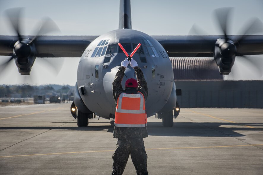 An Airman with the Republic of Korea Air Force signals to a U.S. Air Force C-130J Super Hercules where to stop in preparation for exercise Vigilant Ace 18, Dec. 1, 2017, at Gwangju Airbase, Republic of Korea.