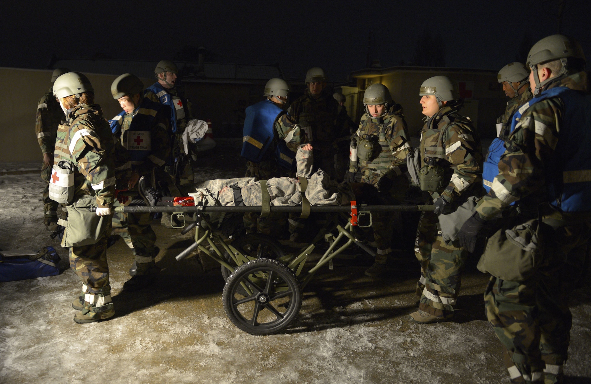 U.S. Air Force 51st Medical Group first responders triage patients with simulated injuries during exercise Vigilant Ace 18 at Osan Air Base, Republic of Korea, Dec. 6, 2017. For exercises like VA18, moulage is applied to personnel during simulated emergency situations to give first responders a sense of realism and urgency to prepare them for wounds they might see in a real-world scenario. (U.S. Air Force photo by Staff Sgt. Alex Fox Echols III)