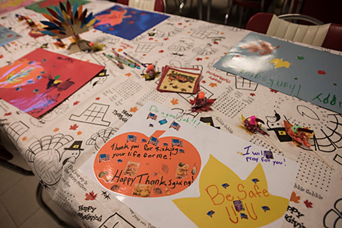 A table is decorated with holiday placemats.