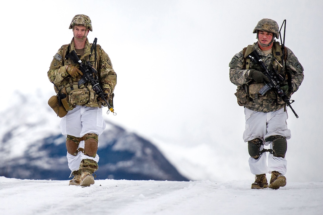 Soldiers participate in parachute insertion and foot patrol training.