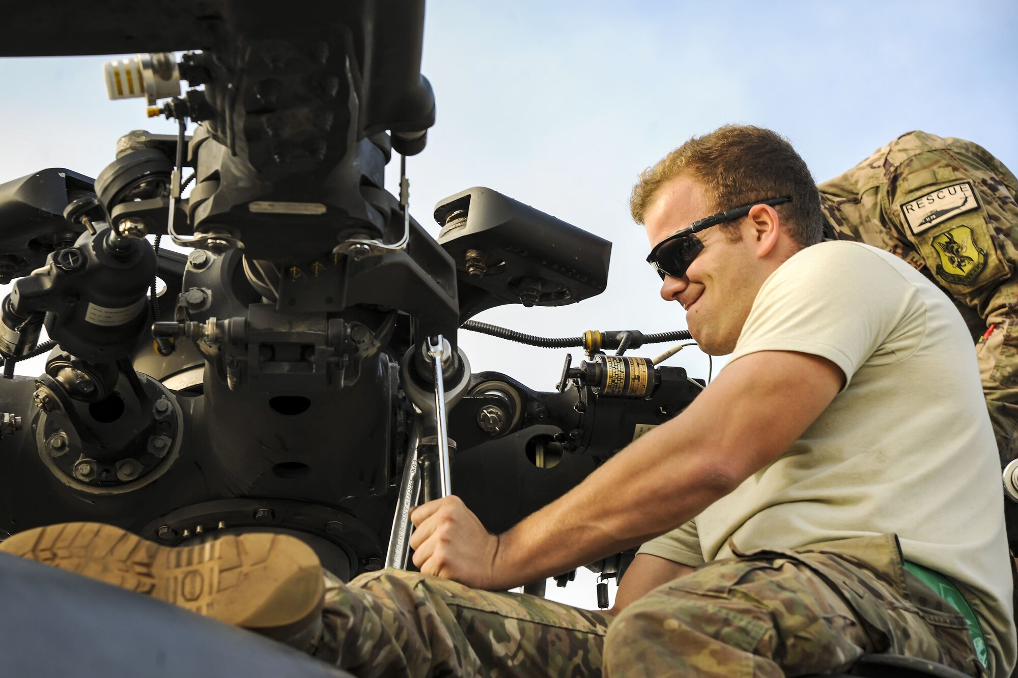 Staff Sgt. Justin Willis, 723d Aircraft Maintenance Squadron crew chief, tightens a screw on the rotor of an HH-60G Pave Hawk, Dec. 5, 2017, at Moody Air Force Base, Ga. As part of a Phase 1, Phase 2 exercise, the 23d Wing is evaluating its operations, maintenance and logistics to determine its readiness to rapidly deploy. Airmen from the 723d Aircraft Maintenance Squadron folded the main and tail rotor blades inward to make it easier to transport and then unfolded the rotors to practice making the helicopter operational. (U.S. Air Force photo by Airman Eugene Oliver)