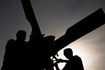Senior Airman Greggory Petkewicz, and Senior Airman Trevor Krutsch, 723d Aircraft Maintenance Squadron crew chiefs, work on the rotor of an HH-60G Pave Hawk, Dec. 5, 2017, at Moody Air Force Base, Ga. As part of a Phase 1, Phase 2 exercise, the 23d Wing is evaluating its operations, maintenance and logistics to determine its readiness to rapidly deploy. Airmen from the 723d Aircraft Maintenance Squadron folded the main and tail rotor blades inward to make it easier to transport and then unfolded the rotors to practice making the helicopter operational. (U.S. Air Force photo by Airman Eugene Oliver)