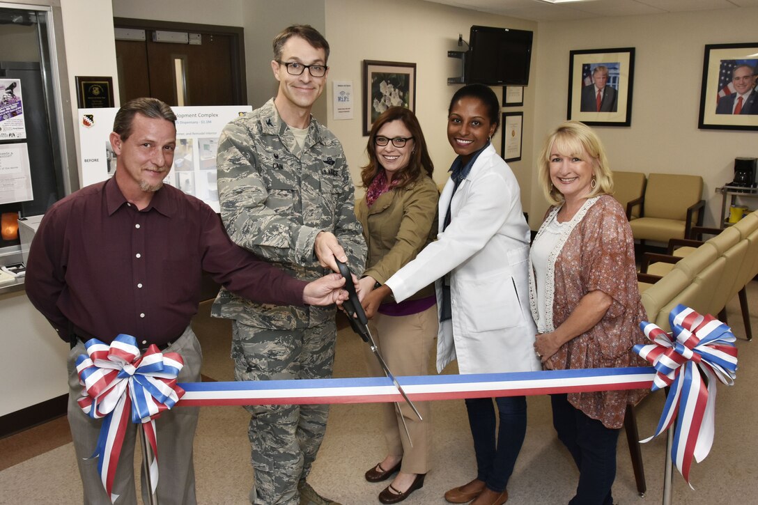 The ribbon is cut to mark the completion of renovations to the Medical Aid Station. Work included new ceilings, flooring, paint and lighting throughout the building. Pictured from left are: Medical Aid Station Chief Fred Kasper; AEDC Commander Col. Scott Cain; Test Support Division Engineering Section Project Manager Jennifer Daugherty; Dr. Tija McDaniels, physician for the Veterans Administration at Arnold AFB; and Lisa Patton, nurse practitioner for the VA at Arnold. (U.S. Air Force photo/Rick Goodfriend)