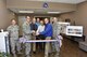 The ceremonial ribbon is cut to mark the completion of renovations to the von Kármán Gas Dynamics Facility Main Test & Laboratory Building. The two-phased project consisted of HVAC replacement, fire suppression system upgrades, and improvements to facility lighting, flooring and walls. The renovation also included both mold and asbestos abatement. Pictured from left are: Col. Timothy West, chief of AEDC Test Operations Division; Col. Scott Cain, AEDC commander; Tony Pennington, Test Support Division Engineering Section project manager; Glenn Liston, chief of the High Speed Experimentation Branch; Barry Banks, NAS Construction superintendent; Lance Baxter, director of the Hypersonics Combined Test Force; and Lt. Col. David Hoffman, director of the Flight Systems CTF. (U.S. Air Force photo/Rick Goodfriend)