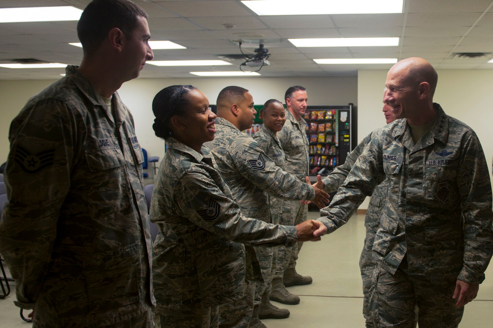 U.S. Air Force Gen. Mike Holmes, commander of Air Combat Command, meets Airmen assigned to the 633rd Logistics Readiness Squadron at Joint Base Langley-Eustis, Va., Dec. 1, 2017. Holmes received briefings outlining the 633rd LRS’ mission accomplishments during the last year in regards to deployments and humanitarian support. (U.S. Air Force photo by Senior Airman Derek Seifert)