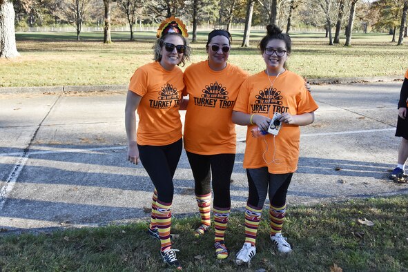 Beth Sinemus, Jory Boudreaux and Annawyn Boudreaux (pictured left to right) show off their Turkey Trot attire after crossing the finish line. The 5K run on Nov. 9 drew more than 50 participants made up of AEDC staff, their families and retirees and service members at Arnold AFB. (U.S. Air Force photo/Rick Goodfriend)