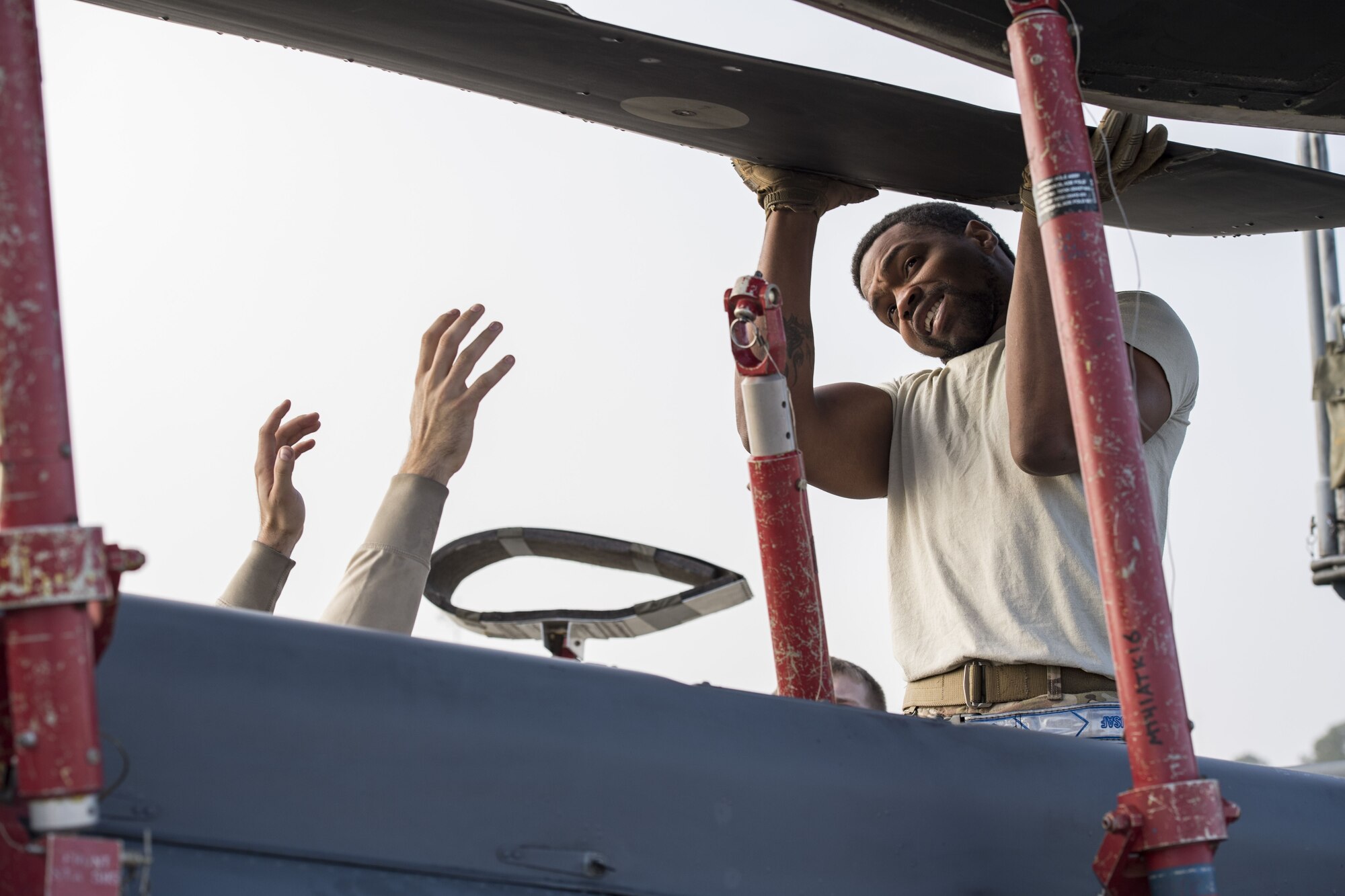 Senior Airman Gary Smith from the 723d Aircraft Maintenance Squadron lifts the rotor of an HH-60G Pave Hawk, during an exercise, Dec. 5, 2017, at Moody Air Force Base, Ga. Moody’s Phase 1, Phase 2 exercise tested the 23d Wing’s ability to prepare, deploy and execute their mission at a moment’s notice. The 723d AMXS was tasked with folding HH-60s in preparation for transport in a larger aircraft and unfolding them once they arrive at their final destination. During folding, the rotor blades are revolved and aligned with the body of the helicopter, and fastened into place. (U.S. Air Force photo by Senior Airman Janiqua P. Robinson)