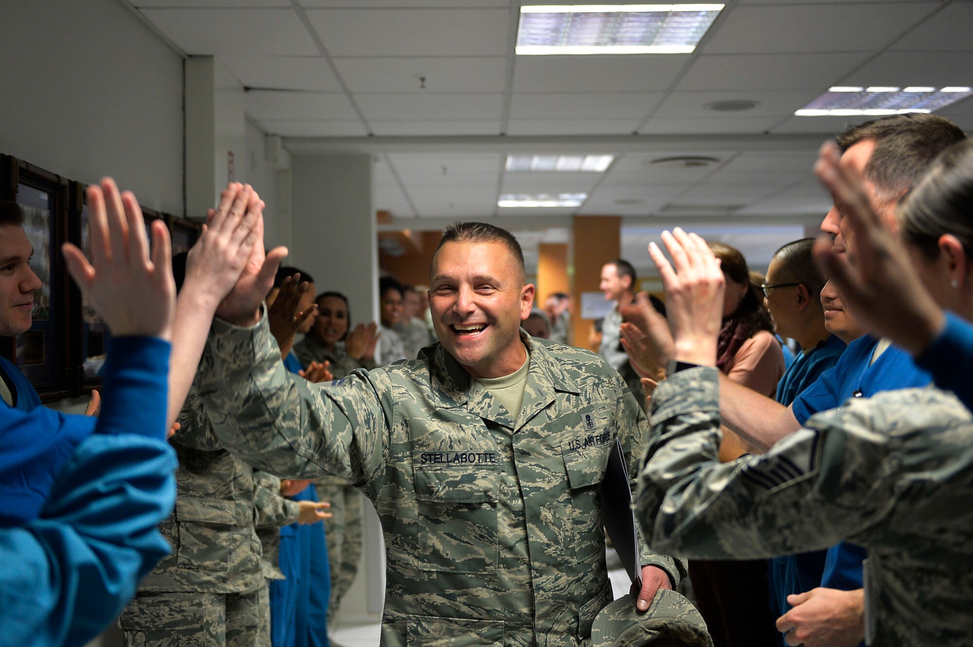 U.S. Air Force Senior Master Sgt. Daniel Stellabotte, 86th Dental Squadron dental operations superintendent, receives congratulations from his colleagues after being selected for promotion to the rank of chief master sergeant. Chief master sergeant corresponds with the pay grade E-9, and is the highest enlisted rank an Airman can attain. (U.S. Air Force photo by Airman 1st Class Joshua Magbanua)