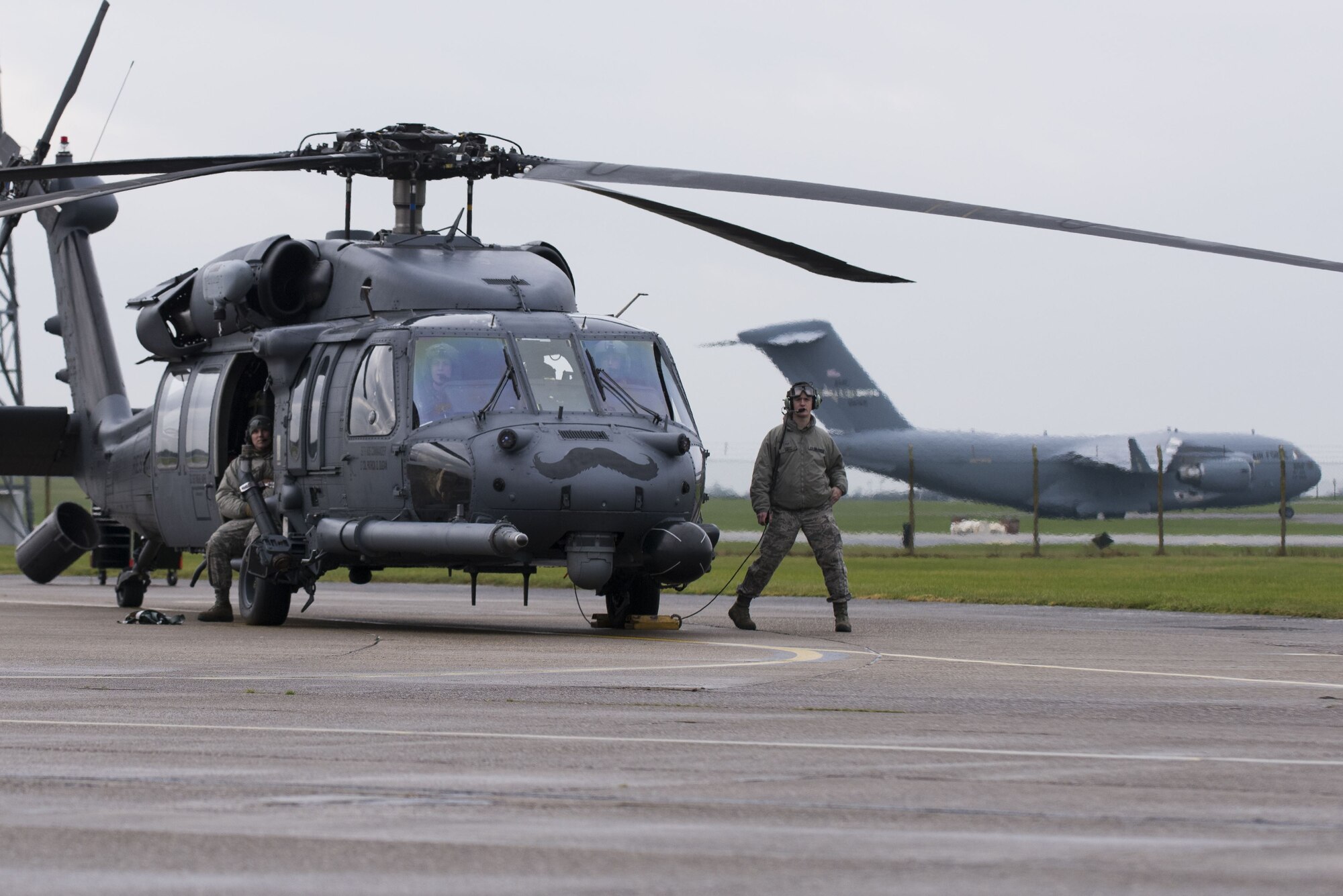 Members of the 56th Rescue Squadron conduct post-flight inspections on an HH-60G Pave Hawk at Royal Air Force Lakenheath, England, Nov. 19, 2017. The 56th RQS aircrews spend approximately 350 hours a year training to safely conduct missions. (U.S. Air Force photo/Senior Airman Malcolm Mayfield)