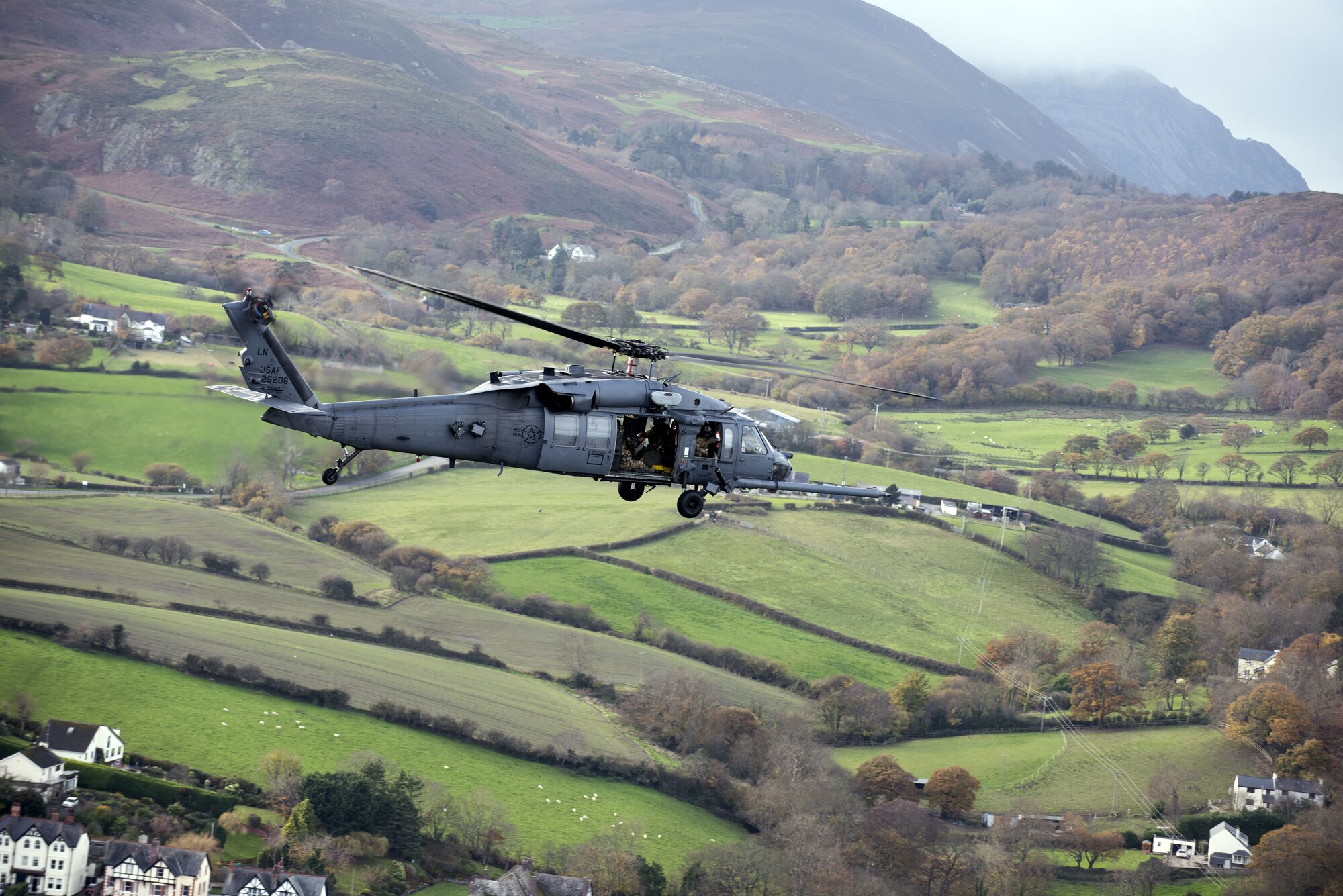 An HH-60G Pave Hawk from the 56th Rescue Squadron flies above Wales Nov. 20, 2017. The 56th RQS provides humanitarian assistance, non-combatant evacuation and disaster relief capability for the U.S. European Command combatant commander and the Joint Chiefs of Staff in peacetime. (U.S. Air Force photo/Senior Airman Malcolm Mayfield)