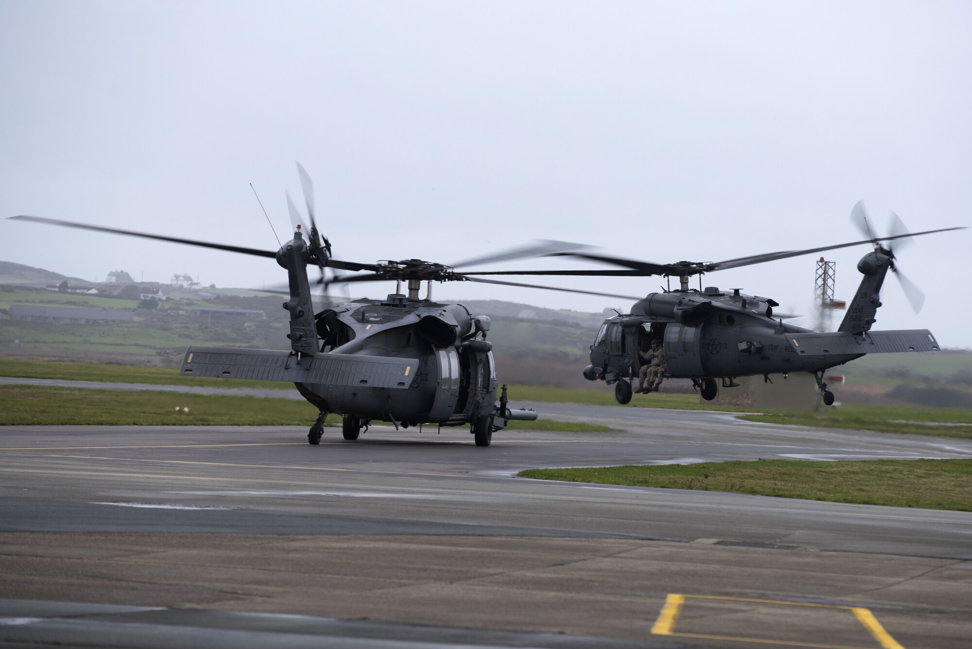 HH-60G Pave Hawks from the 56th Rescue Squadron prepare to lift-off at Royal Air Force Valley, Wales, Nov. 20, 2017. The aircraft has proven itself in combat search and rescue missions since Operation Desert Storm and continues the CSAR mission to this day. (U.S. Air Force photo/Senior Airman Malcolm Mayfield)