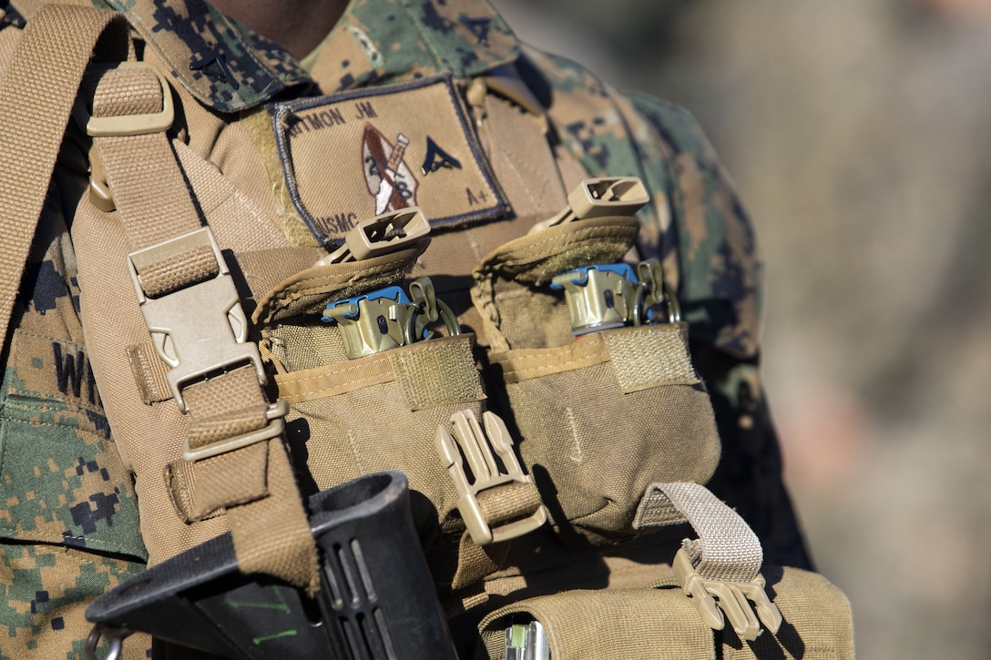 Marines carry loaded grenades during execise