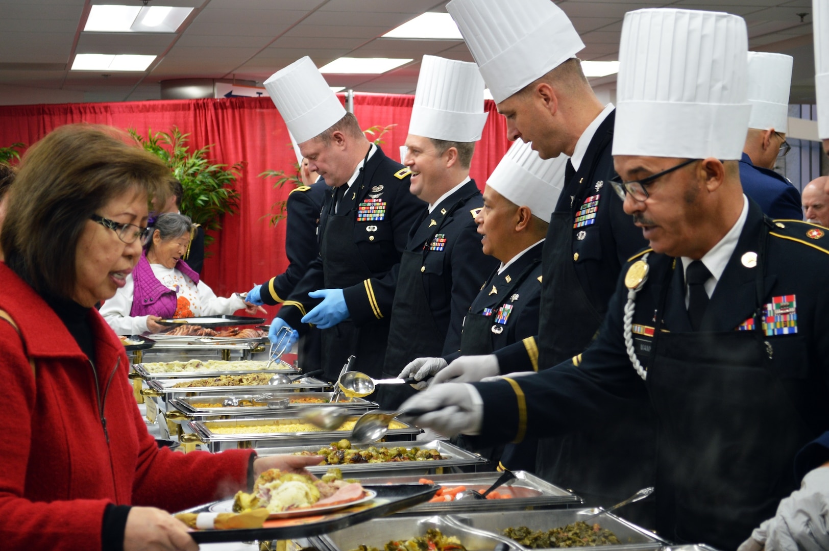 Members of the Brooke Army Medical Center command staff serve Thanksgiving dinner to more than 1,000 guests Nov. 23 in the BAMC Dining Room at Joint Base San Antonio-Fort Sam Houston.