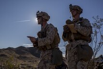 U.S. Marines 2nd Lt. John Donovan and Cpl. Tanner Reihm establish sectors of fire during a Marine Corps Combat Readiness Evaluation (MCCRE) at Marine Corps Air Ground Combat Center, Twentynine Palms, Calif., Nov. 28, 2017.