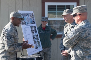 U.S. Air Force Gen. Mike Holmes, commander of Air Combat Command, and Chief Master Sgt. Frank Batten II, command chief of ACC, receives a mission brief from Airmen assigned to the 733rd Logistics Readiness Squadron during a tour of Joint Base Langley-Eustis, Va., Dec. 1, 2017. Holmes and Batten were briefed on JBLE's Chemical Biological Radiological and Nuclear procedures. (U.S. Air Force photo by Senior Airman Derek Seifert)