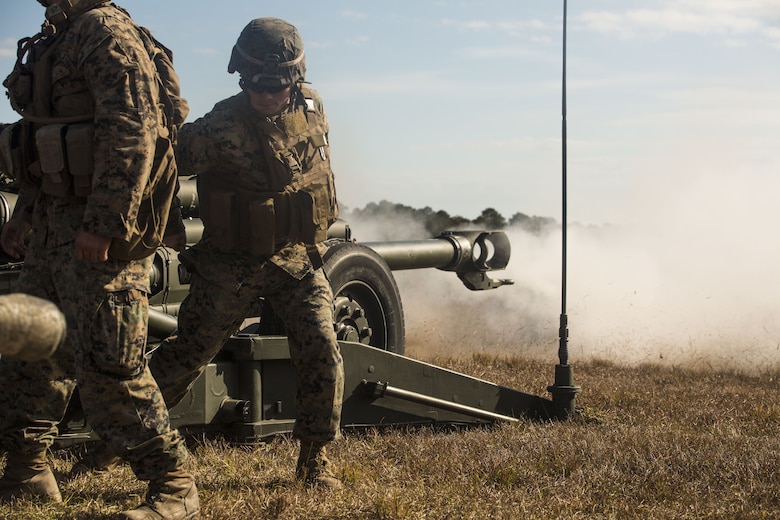 A Marine pulls the cord to fire an M777 A2 howitzer during a direct-fire exercise at Camp Lejeune, N.C., Dec. 4, 2017. The M777 provides timely, accurate and continuous indirect fire support, while having the capability to engage targets directly in the event of enemy contact. The Marines are with 1st Battalion 10th Marine Regiment. (U.S. Marine Corps photo by Cpl. Luke Hoogendam)