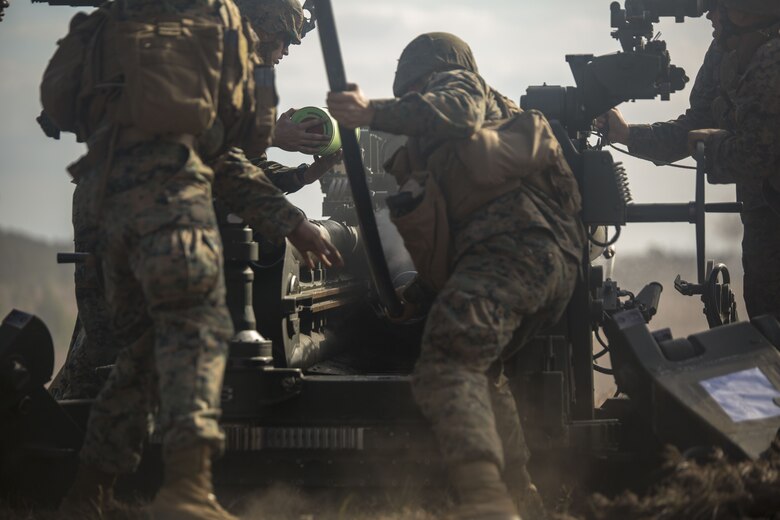 Marines load an artillery round into an M777 A2 howitzer during a direct-fire exercise at Camp Lejeune, N.C., Dec. 4, 2017. The M777 provides timely, accurate and continuous indirect fire support, while having the capability to engage targets directly in the event of enemy contact. The Marines are with 1st Battalion 10th Marine Regiment. (U.S. Marine Corps photo by Cpl. Luke Hoogendam)