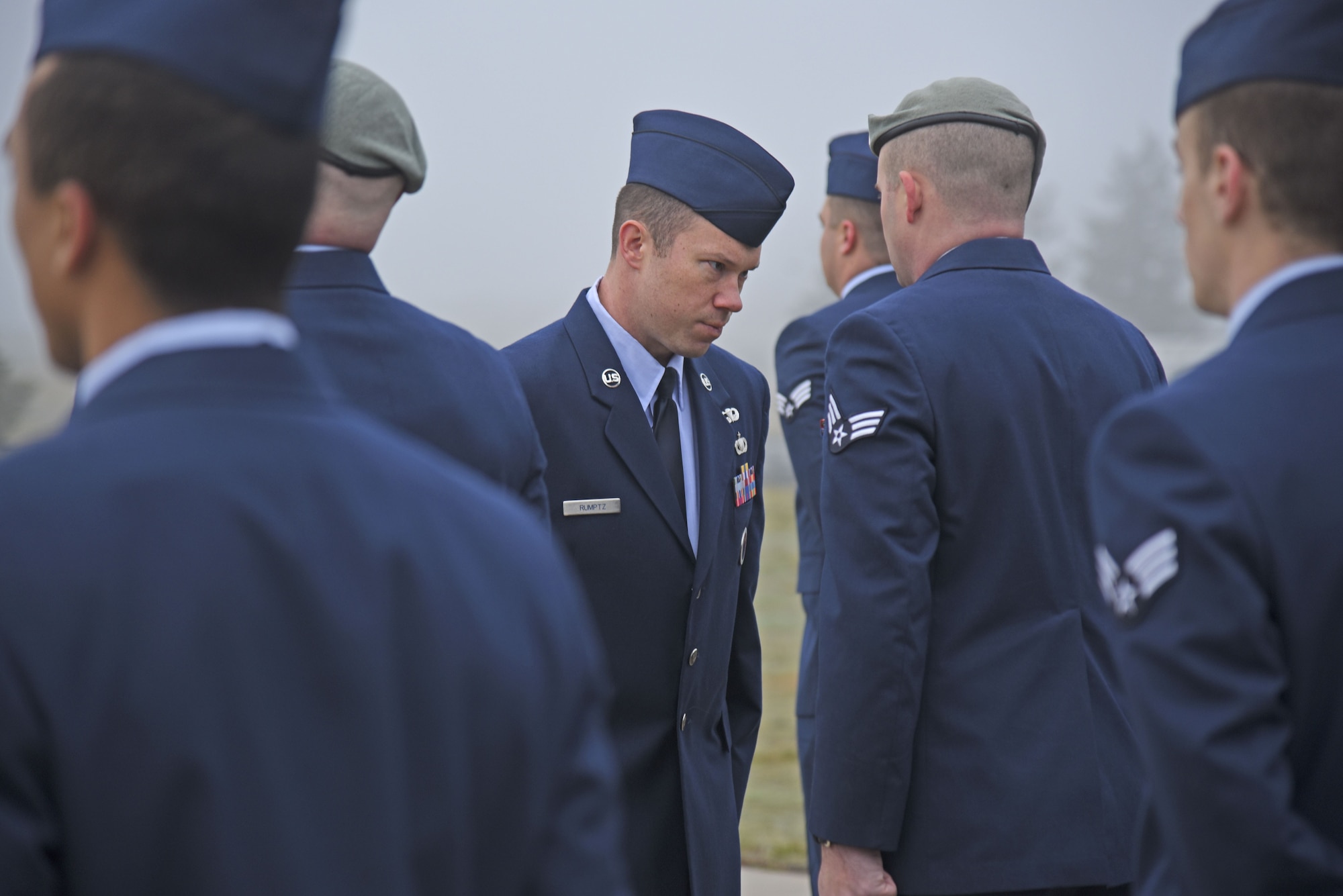 Staff Sgt. Matthew Rumptz, 92nd Force Support Squadron Airman Leadership School instructor, conducts a uniform inspection as one of the graduation requirements of ALS Nov. 21, 2017, at Fairchild Air Force Base, Washington. ALS is an in-house course that prepares senior airmen to be professional, war-fighting Airmen who can supervise and lead Air Force work teams to support the employment of airpower. (U.S. Air Force photo/Senior Airman Mackenzie Richardson)