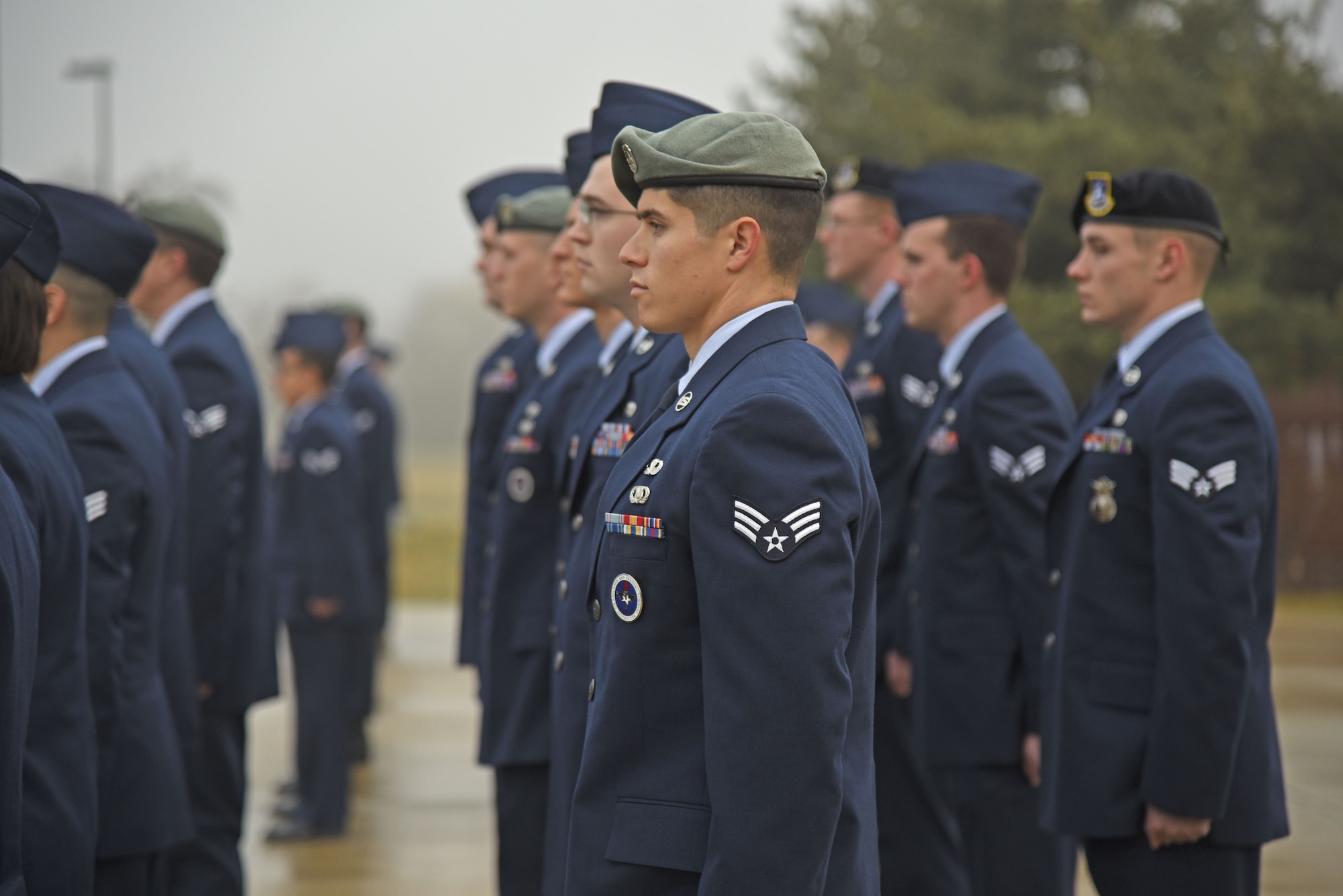 Airman Leadership School Class 18-A Tanker Flight conducts open ranks in preparation for a service dress uniform inspection Nov. 21, 2017, at Fairchild Air Force Base, Washington. The uniform inspections ensure Airmen are maintaining a professional appearance at all times. (U.S. Air Force photo/Senior Airman Mackenzie Richardson)