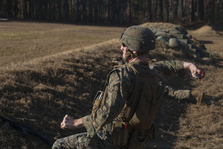 A Marine with 2nd Battalion, 8th Marine Regiment throws an M69 training grenade at a grenade range during a deployment for training exercise at Fort A.P. Hill, V.A., Dec. 1, 2017. The range consisted of the Marines reacting to enemy contact, buddy rushing, using M69 training grenades and M67 fragmentation grenades. The Marines are conducting the DFT to maintain proficiency at the squad, platoon, company, and battalion-level of warfighting in preparation for an upcoming deployment to Japan. (U.S. Marine Corps photo by Lance Cpl. Ashley McLaughlin)