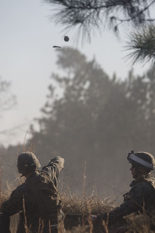 A Marine with 2nd Battalion, 8th Marine Regiment throws an M67 fragmentation grenade at a grenade range during a deployment for training exercise at Fort A.P. Hill, V.A., Dec. 1, 2017. The range consisted of the Marines reacting to enemy contact, buddy rushing, using M69 training grenades and M67 fragmentation grenades. The Marines are conducting the DFT to maintain proficiency at the squad, platoon, company, and battalion-level of warfighting in preparation for an upcoming deployment to Japan. (U.S. Marine Corps photo by Lance Cpl. Ashley McLaughlin)