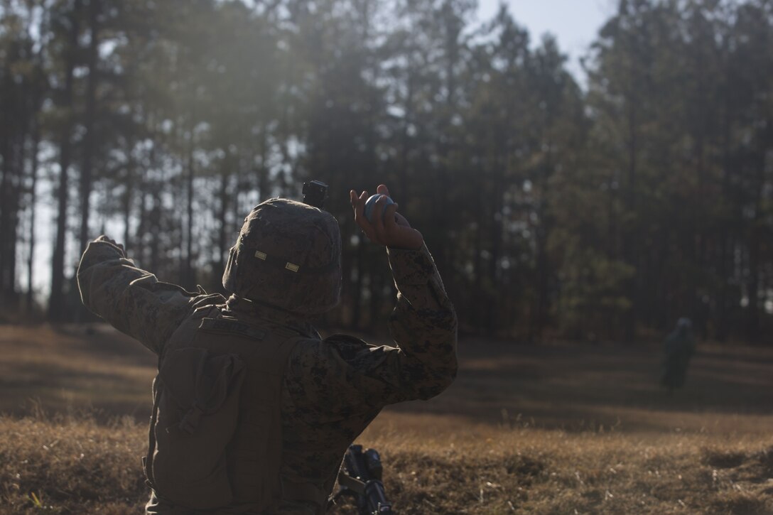 A Marine with 2nd Battalion, 8th Marine Regiment throws an M69 training grenade at a grenade range during a deployment for training exercise at Fort A.P. Hill, V.A., Dec. 1, 2017. The range consisted of the Marines reacting to enemy contact, buddy rushing, using M69 training grenades and M67 fragmentation grenades. The Marines are conducting the DFT to maintain proficiency at the squad, platoon, company, and battalion-level of warfighting in preparation for an upcoming deployment to Japan. (U.S. Marine Corps photo by Lance Cpl. Ashley McLaughlin)
