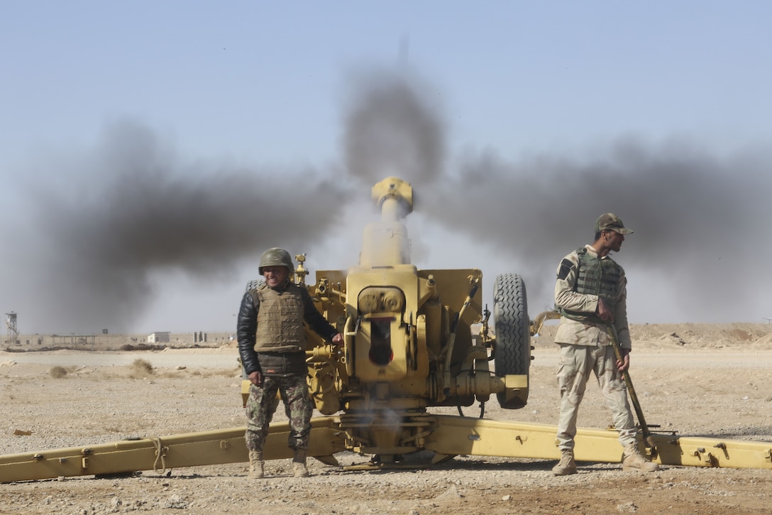An Afghan National Army soldier with 1st Brigade, 215th Corps fires a 122mm howitzer D-30 prior during a live-fire training event at Camp Shorabak, Afghanistan, Dec. 5, 2017. The event concluded an eight-week artillery training course, which brought together more than 25 soldiers from the brigade to enhance their fire support capabilities. Led by U.S. Marine advisors with Task Force Southwest, the students will use their artillery skills to support infantry units during combat operations in Helmand province. (U.S. Marine Corps photo by Sgt. Lucas Hopkins)