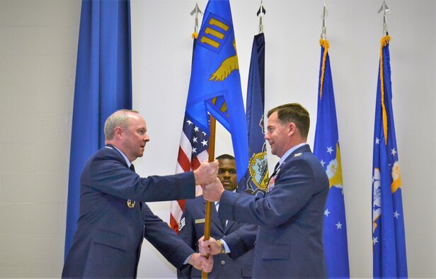 Pa. National Guard Deputy Adjutant General – Air, Col. Michael Regan, hands the 111th Attack Wing guidon to incoming 111th ATKW Commander Col. William Griffin during the change of command ceremony held Nov. 3, 2017 at Horsham Air Guard Station, Pa. Griffin served at flight squadron command levels and, most recently, was the Wing’s vice commander since 2013. (U.S. Air National Guard photo by Tech. Sgt. Andria Allmond)