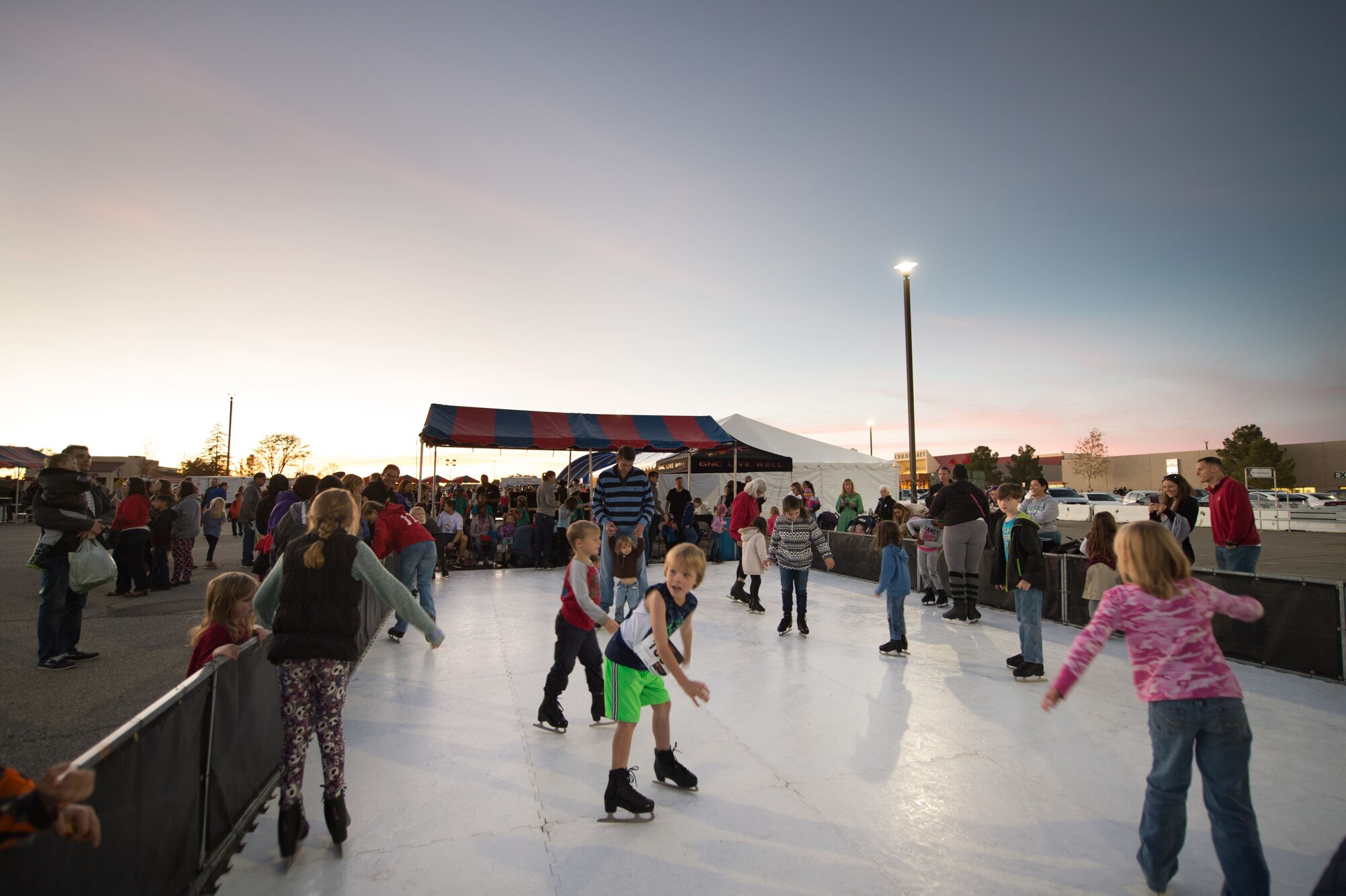 Kids at Edwards enjoy a bit of twilight skating during Winterfest held Dec. 1.  Winterfest was organized by the 412th Force Support Squadron. (U.S. Air Force photo by Jennifer Correa)