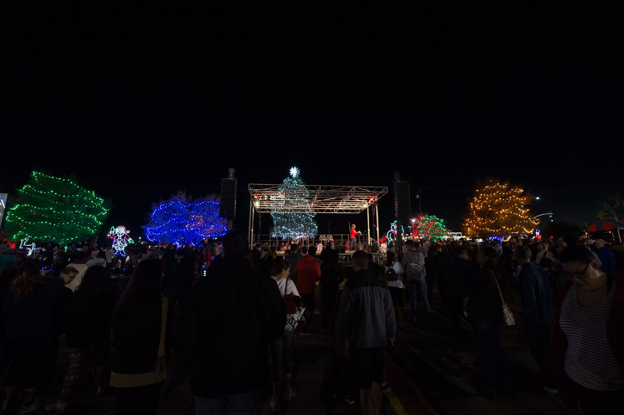 Team Edwards gathers in the Edwards Main Exchange parking lot for the tree lighting and the live performances during Winterfest Dec. 1. (U.S. Air Force photo by Jennifer Correa)