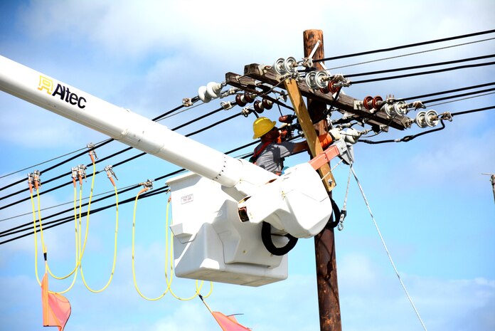 A USACE contractor works on repairing power lines near San Juan, Puerto Rico as part of the agency's work to help restore power on the island.
