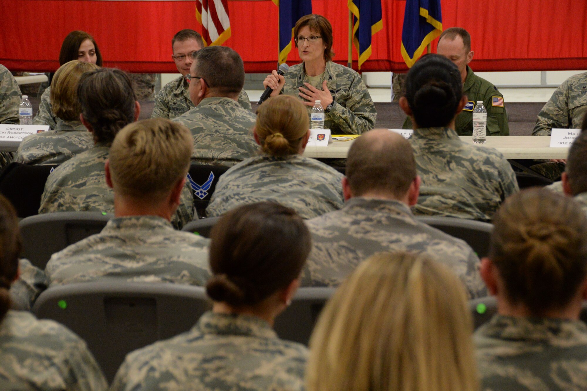 Col. Karen Steiner, the 302nd Aeromedical Staging Squadron commander, answers a question from the audience during the December Unit Training Assembly Commander’s Call Dec. 3, 2017 at Peterson Air Force Base, Colo. More than 700 Reserve Citizen Airmen attended the call and had the opportunity to send text messages with questions to a panel of the Reserve wing’s group and squadron commanders. (U.S. Air Force photo/Staff Sgt. Frank Casciotta)