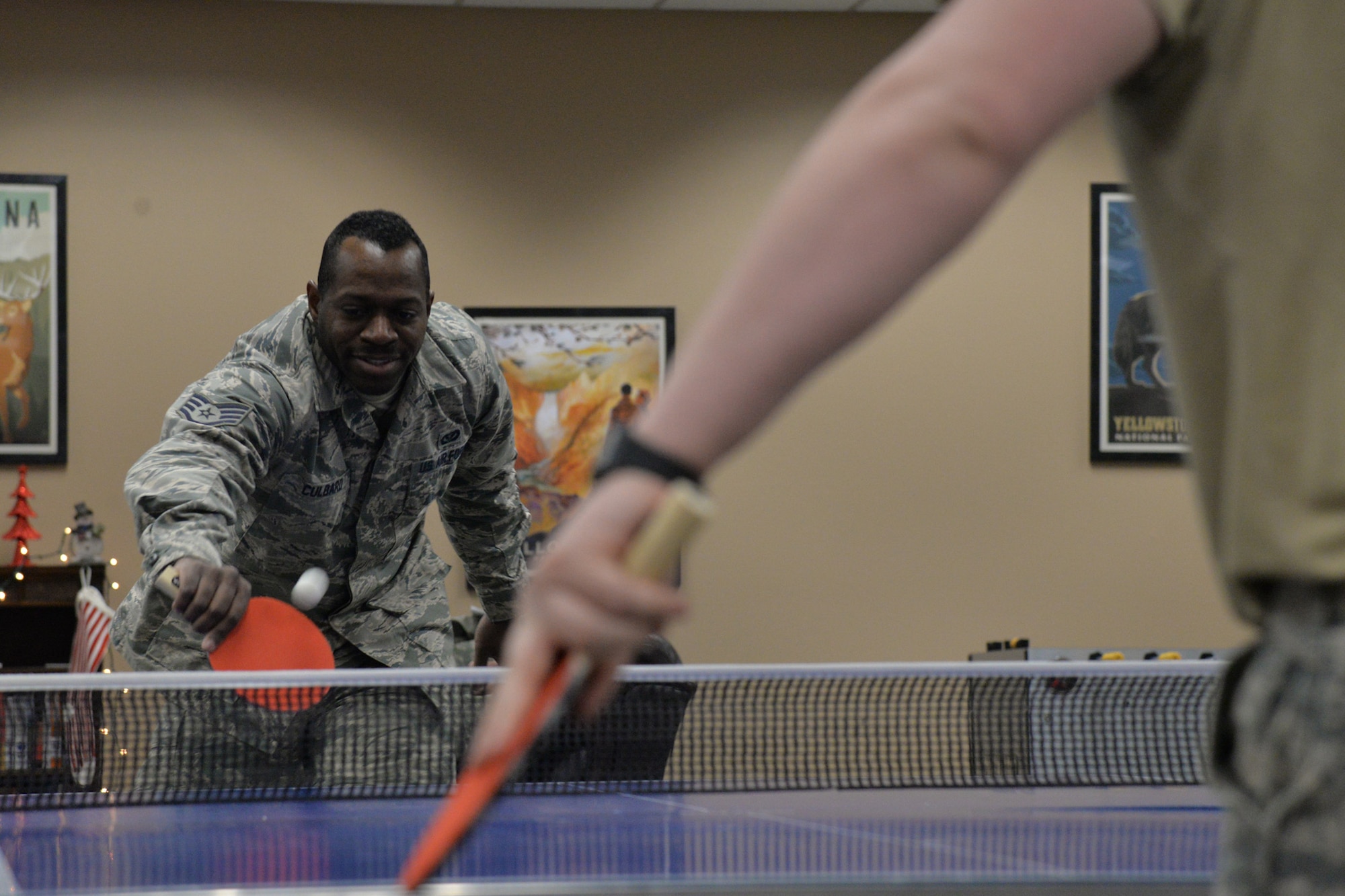 Staff Sgt. Keron Culbard, 341st Civil Engineer Squadron water and fuels system technician, left, plays table tennis with Senior Airman Eric Oliver, 341st CES water and fuels system technician, at the resilience center Dec. 6, 2017, at Malmstrom Air Force Base, Mont.