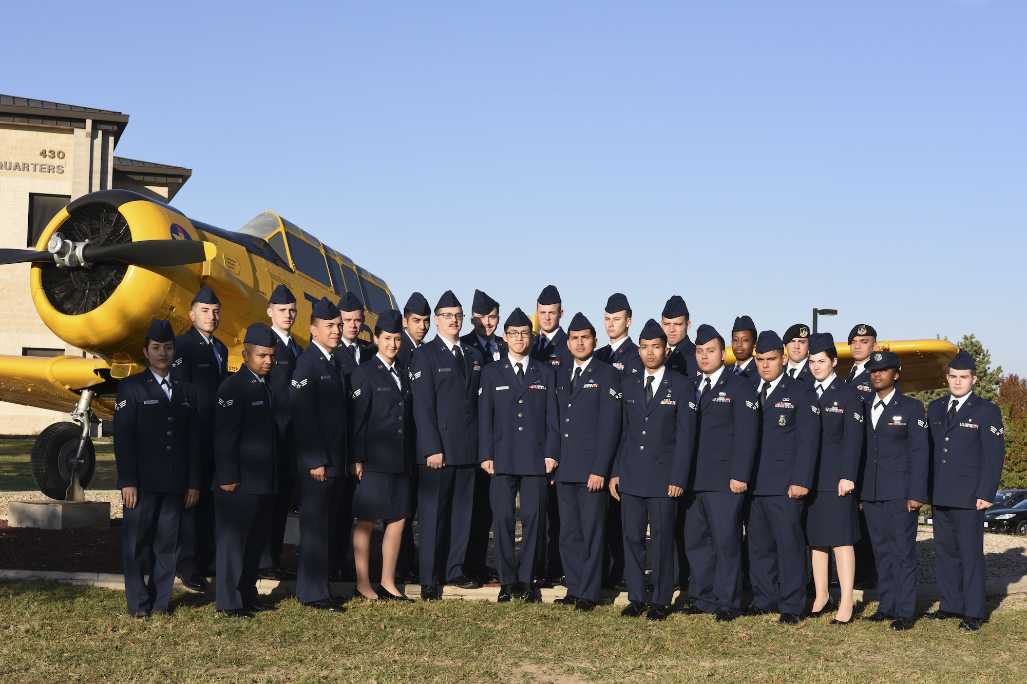Airman Leadership School Class 18-A stands before the T-6 Texan static plane display on Goodfellow Air Force Base, Texas, Nov. 27, 2017. ALS is a six-week course designed to prepare senior airmen to assume supervisory duties by offering instruction in leadership, followership, written and oral communication skills, and the profession of arms.