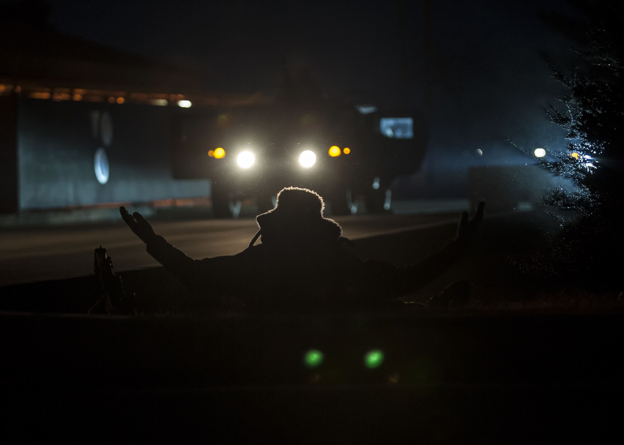 A U.S. Air Force Airman assigned to the 8th Security Forces Squadron acts as a member of an opposing force to simulate a base attack during exercise VIGILANT ACE 18 at Kunsan Air Base, Republic of Korea, Dec. 6, 2017. The week-long exercise tested the squadron’s ability to defend the base in a wartime scenario. Various simulated attacks on the installation enhanced the skills and training of Wolf Pack Airmen and their ability to respond to threats. (U.S. Air Force photo by Staff Sgt. Victoria H. Taylor)