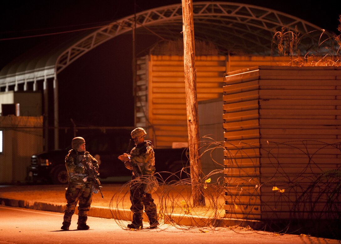 U.S. Air Force Airmen assigned to the 8th Security Forces Squadron defend the base during a simulated attack while participating in exercise VIGILANT ACE 18 at Kunsan Air Base, Republic of Korea, Dec. 6, 2017. The week-long exercise tested the squadron’s ability to defend the base in a wartime scenario with various simulated attacks and intrusions on the installation to further enable the Wolf Pack’s ability to generate aircraft. (U.S. Air Force photo by Staff Sgt. Victoria H. Taylor)