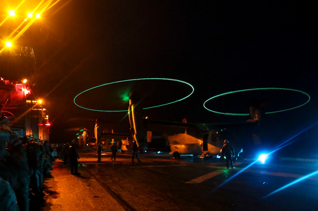 A MV-22B Osprey with Marine Medium Tiltrotor Squadron (VMM) 162 (Reinforced), 26th Marine Expeditionary Unit (MEU), prepares to take off from the amphibious assault ship USS Iwo Jima (LHD 7) during an amphibious assault which served as the culminating event for the Combined Composite Training Unit Exercise (COMPTUEX) in the Atlantic Ocean, Dec. 7, 2017. The exercise allows all elements of the Marine Air Ground Task Force (MAGTF) to join and train in realistic scenarios so the MEU as a whole can meet its Pre-Deployment Training Program objectives prior to their upcoming deployment at sea.
