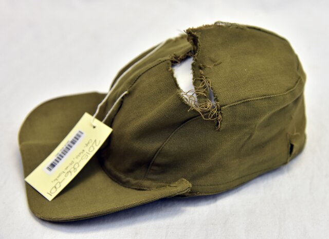 Plans call for this artifact to be displayed near the B-17F Memphis Belle™ as part of the new strategic bombardment exhibit in the WWII Gallery, which opens to the public on May 17, 2018. Lt Col Robert Kratz, a 455th BG B-24 bombardier who flew 52 combat missions, was holding this cap when a fragment passed through it.