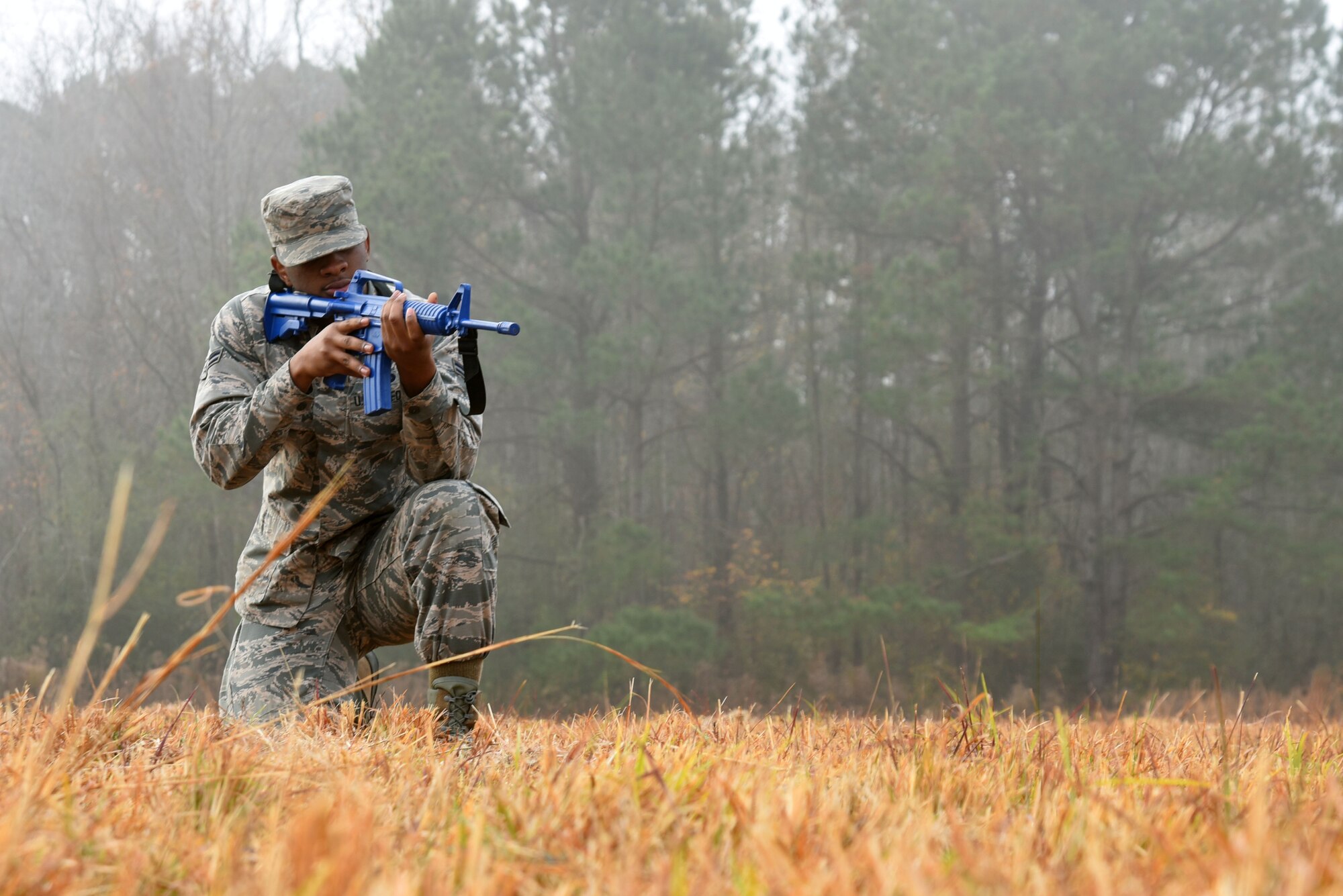 U.S. Air Force Airman 1st Class Taryph Moses, 20th Force Support Squadron food service journeyman, holds a training rifle while participating in a team movement training at Poinsett Electronic Combat Range near Wedgefield, S.C., Dec. 5, 2017.