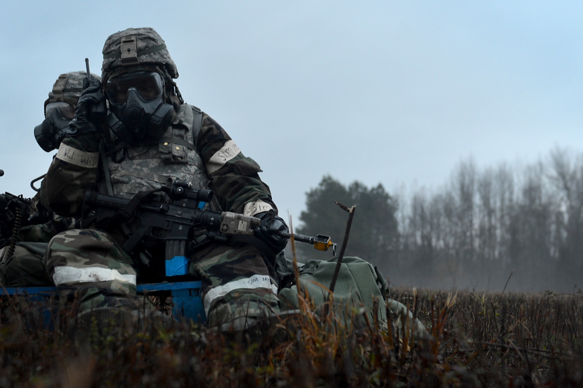 A U.S. Airman assigned to the 20th Fighter Wing listens to a land mobile radio during a Poinsett Ready Weasel Adaptive Basing Exercise at Poinsett Electronic Combat Range, near Wedgefield, S.C., Dec. 6, 2017.