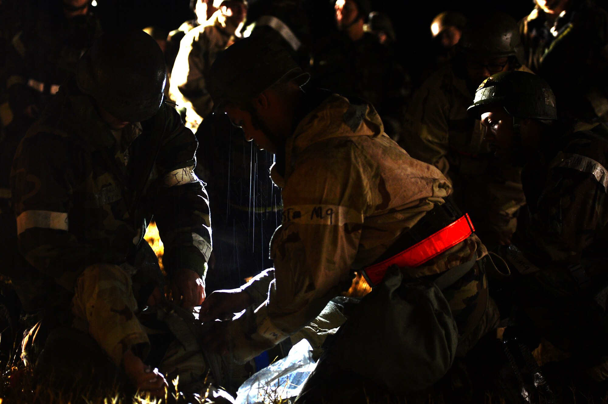 U.S. Airmen assigned to the 20th Medical Group perform self-aid buddy care during a Poinsett Ready Weasel Adaptive Basing Exercise at Poinsett Electronic Combat Range, near Wedgefield, S.C., Dec. 6, 2017.