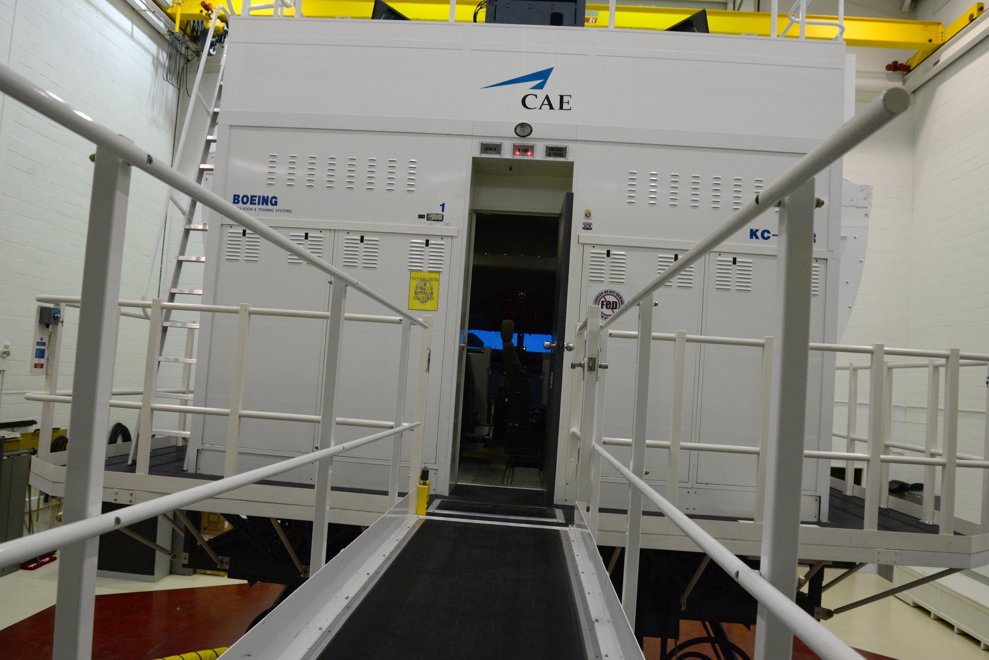 The walkway into a KC-135 Stratotanker flight simulator retracts before each use because the entire unit is raised on motion legs. The visuals, equipment and movement of the unit are vital to the realistic training environment of the simulator. (U.S. Air Force photo by Senior Airman Justine Rho)