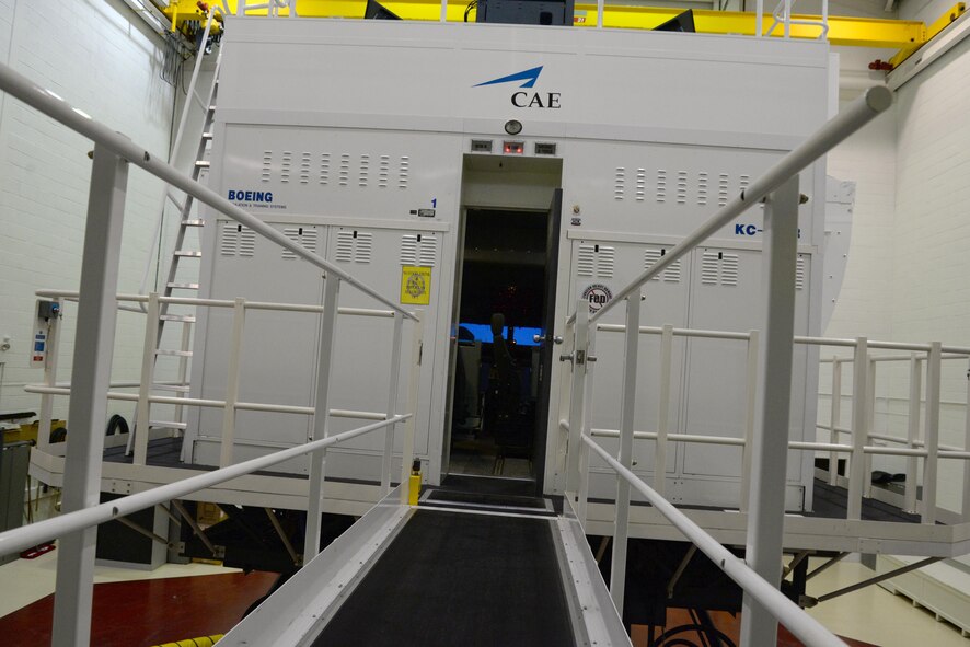The walkway into a KC-135 Stratotanker flight simulator retracts before each use because the entire unit is raised on motion legs. The visuals, equipment and movement of the unit are vital to the realistic training environment of the simulator. (U.S. Air Force photo by Senior Airman Justine Rho)