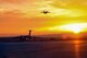 An Air Force C-5M Super Galaxy from the 22nd Airlift Squadron lands as a C-17 Globemaster III takes off at Marine Corps Air Station Miramar, Calif., Nov. 18, 2017. The aircraft delivered equipment and personnel to Argentina to help in the search for the Argentina Navy submarine ARA San Juan. (U.S. Air Force photo by Staff Sgt. Nicole Leidholm)