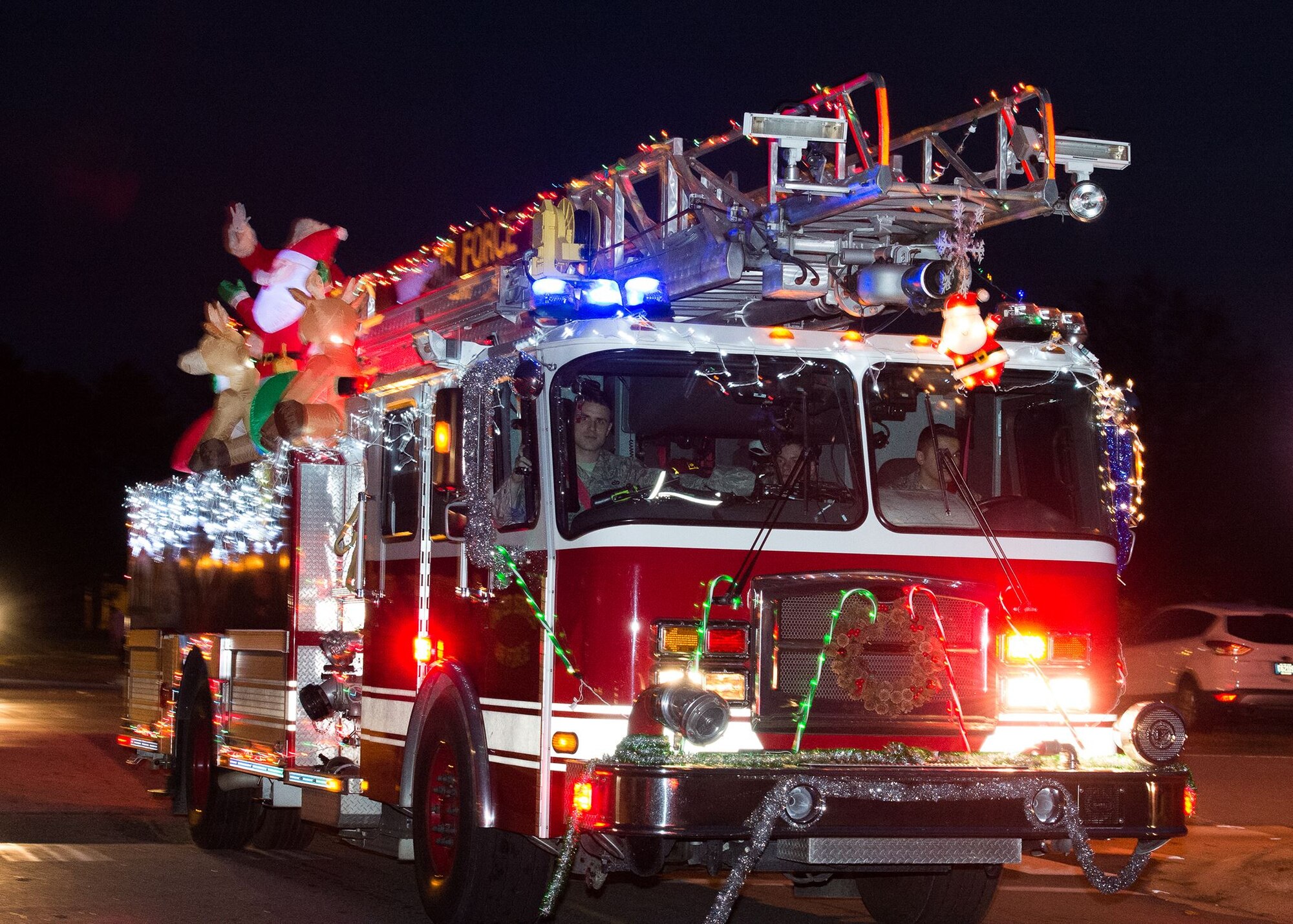 Airmen of the 436th Civil Engineer Squadron participate in the 2017 Dover Air Force Base Holiday Parade Dec. 5, 2017, at the Eagle Heights family housing on Dover Air Force Base, Del.