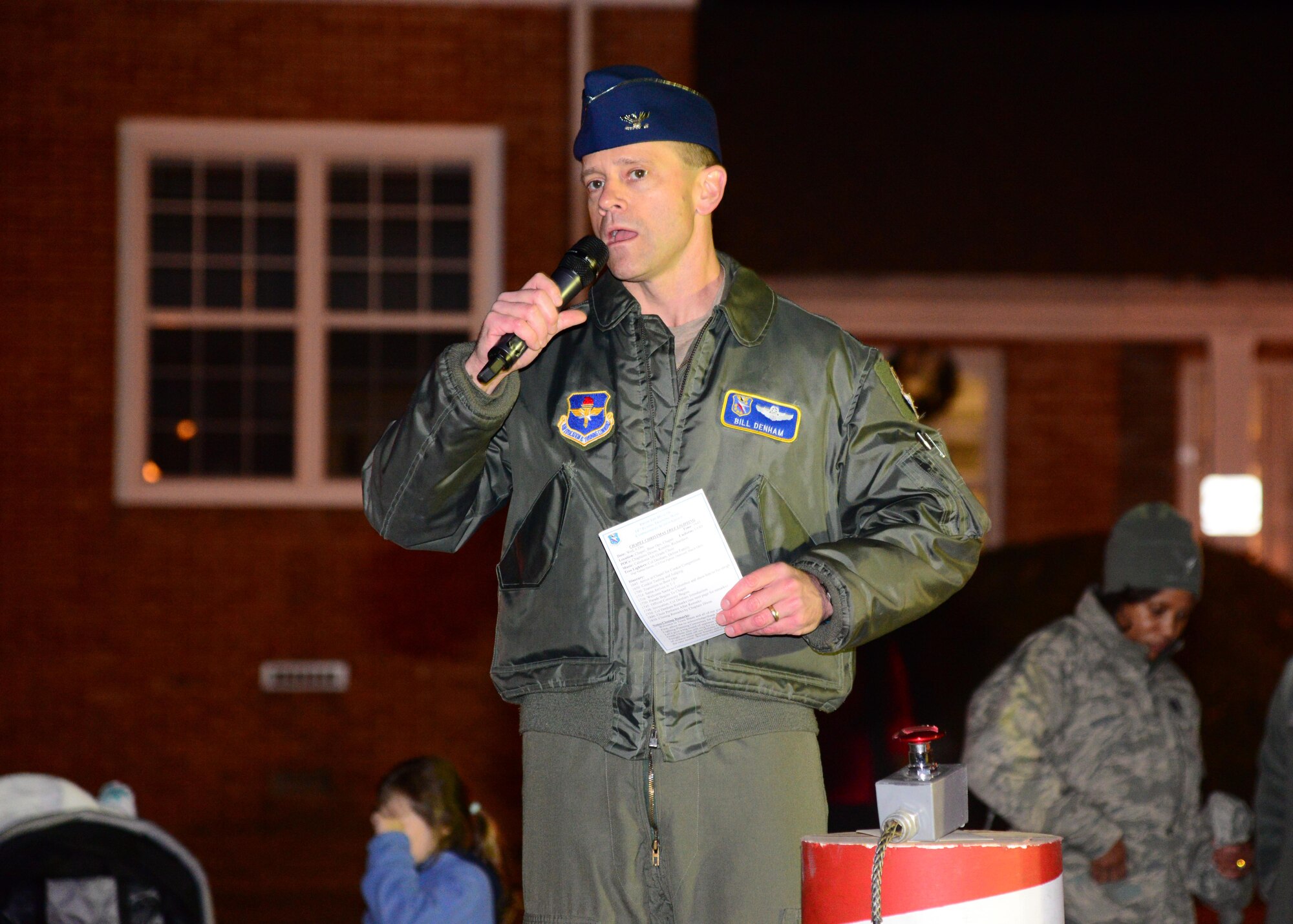 Col. William Denham, 14th Flying Training Wing Vice Commander, speaks at the base Christmas tree lighting Dec. 6, 2017, on Columbus Air Force Base, Mississippi. Following the tree lighting, numerous activities took place, the first being a cookie competition judged by Denham in which the 14th Wing Staff Agencies team won. (U.S. Air Force photo by Airman 1st Class Beaux Hebert)