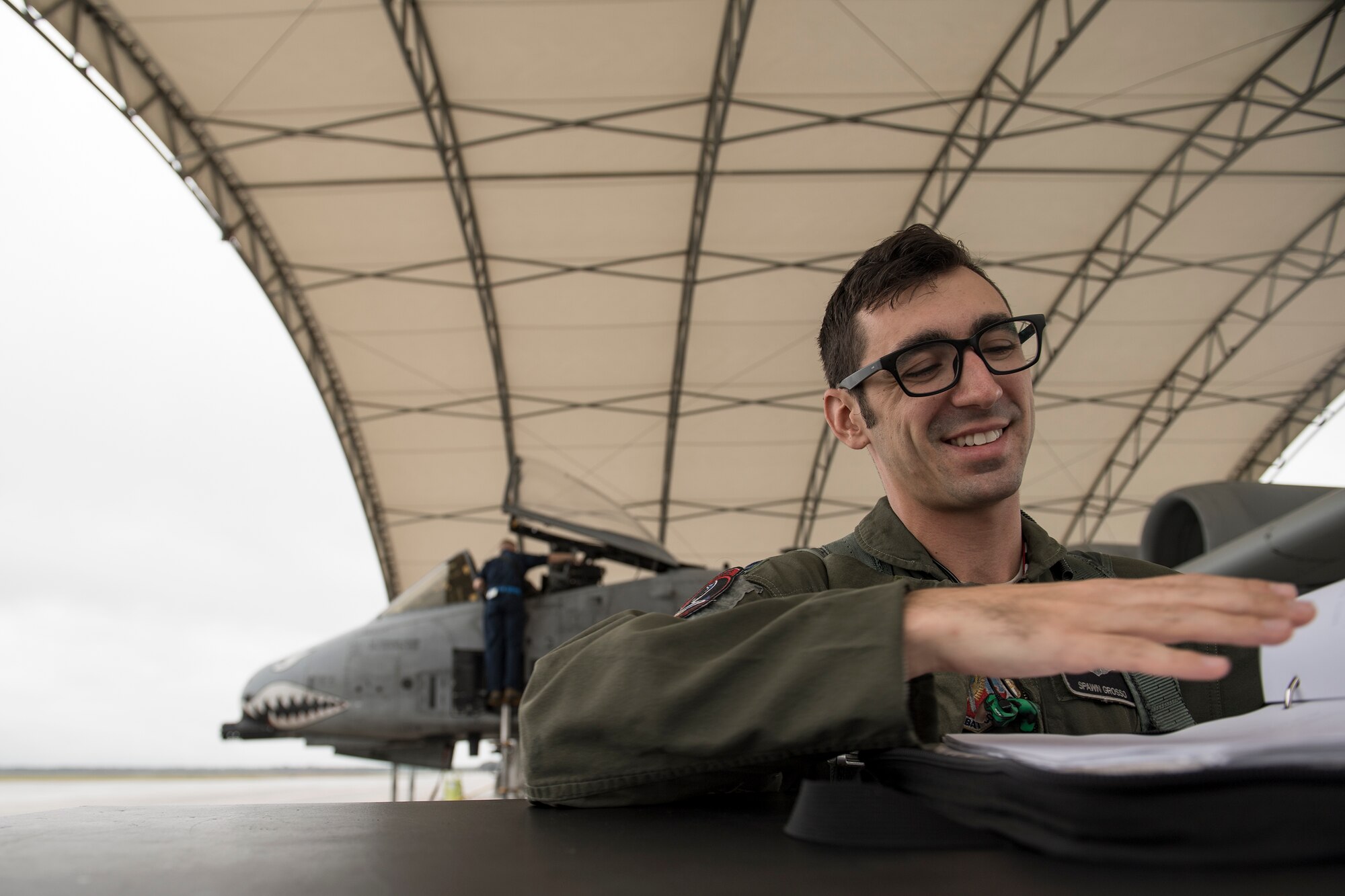 Capt. Maurice Grosso, 75th Fighter Squadron A-10C Thunderbolt II pilot, looks over paperwork prior to a sortie, Dec. 6, 2017, at Moody Air Force Base, Ga. Moody’s week-long, Phase 1, Phase 2 exercise is designed to demonstrate the 23d Wing’s ability to meet combatant commander objectives and tested the pilots’ and maintainers’ ability to launch around-the-clock sorties at an accelerated rate during a sortie surge. (U.S. Air Force photo by Staff Sgt. Ryan Callaghan)