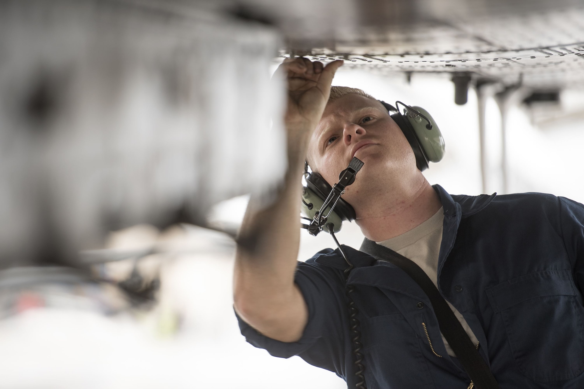 Airman 1st Class Tyler Boyd, 74th Aircraft Maintenance Unit crew chief, secures aircraft panels on the bottom of an A-10C Thunderbolt II during pre-flight checks, Dec. 6, 2017, at Moody Air Force Base, Ga. Moody’s week-long, Phase 1, Phase 2 exercise is designed to demonstrate the 23d Wing’s ability to meet combatant commander objectives and tested the pilots’ and maintainers’ ability to launch around-the-clock sorties at an accelerated rate during a sortie surge. (U.S. Air Force photo by Staff Sgt. Ryan Callaghan)